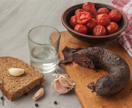 Ring pudding sausages  and a piece of bread photo