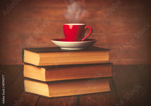 Cup of coffee and books