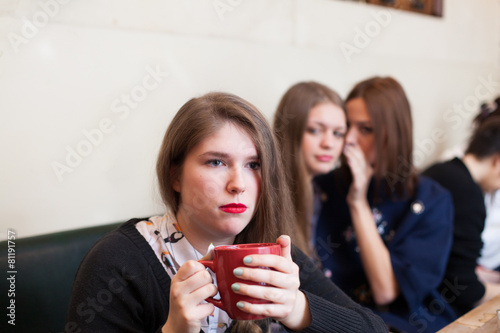 gossiping a friend in a a cafe photo