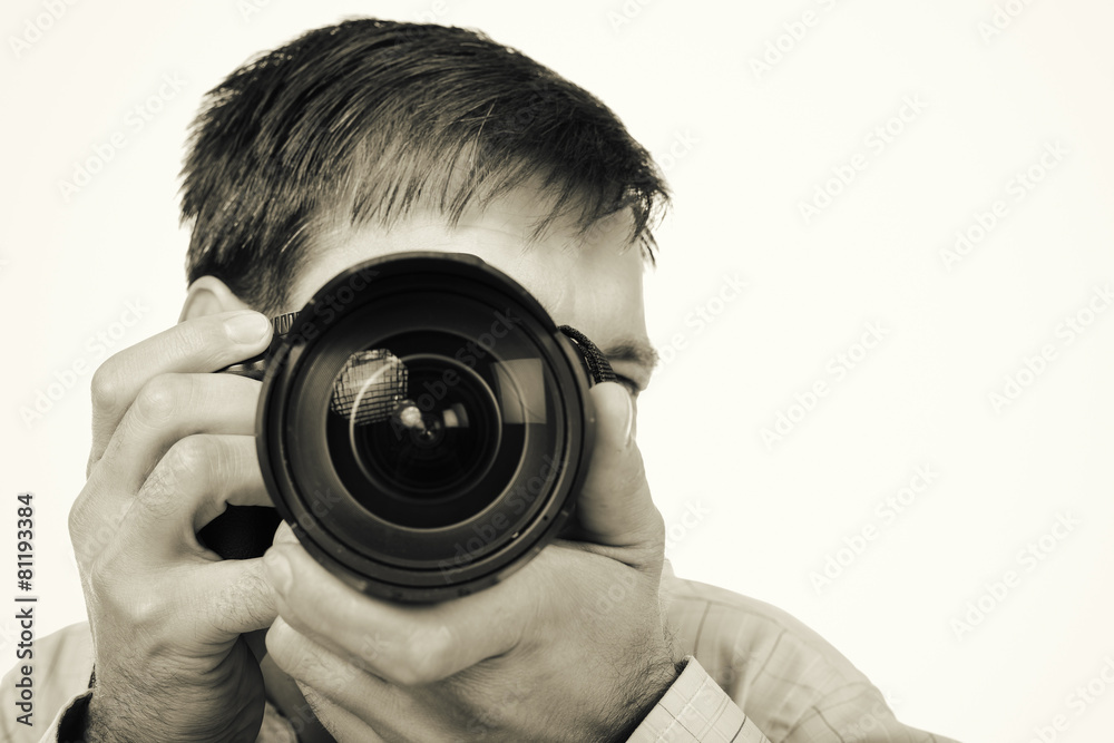 Young man with professional camera