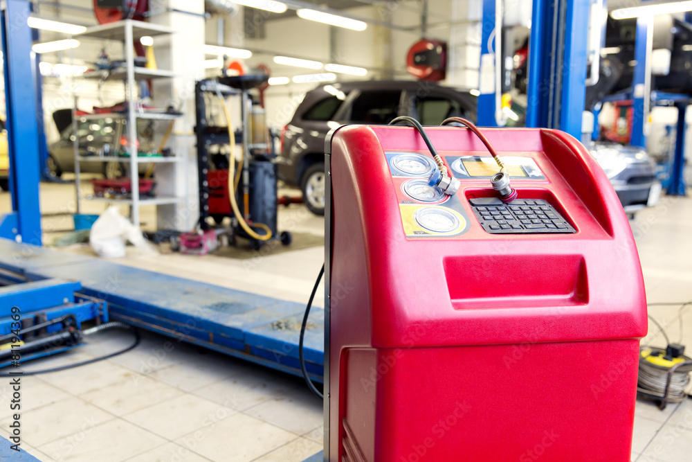 Car air conditioner charging machine at service station Stock Photo