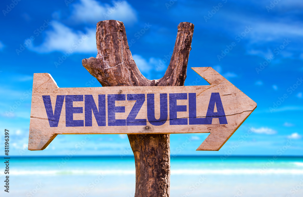 Venezuela wooden sign with beach background