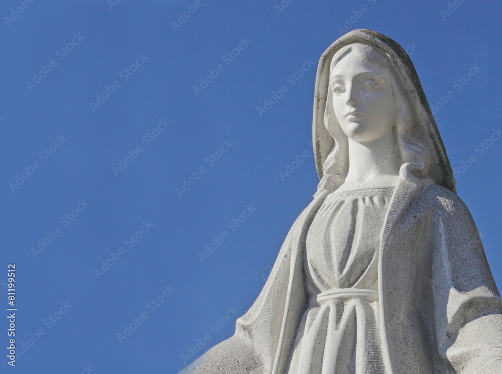 Virgin Mary on the blue background of sky