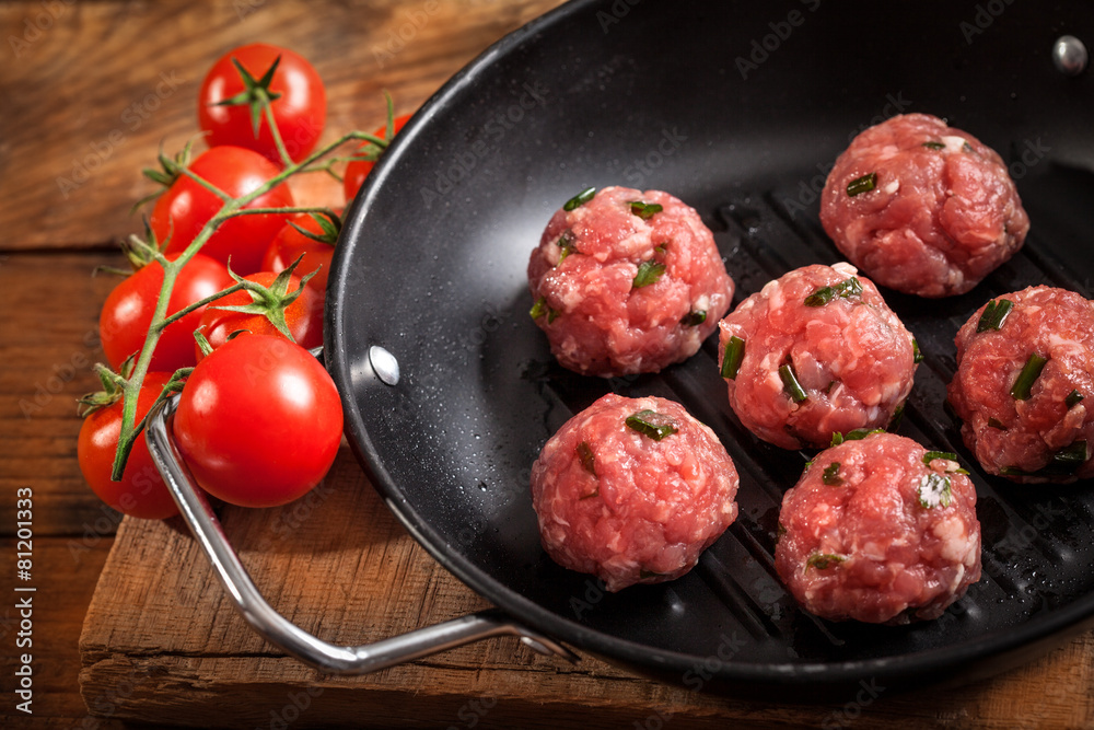 Raw meatballs wih cherry tomato Raw meatballs wih cherry tomato