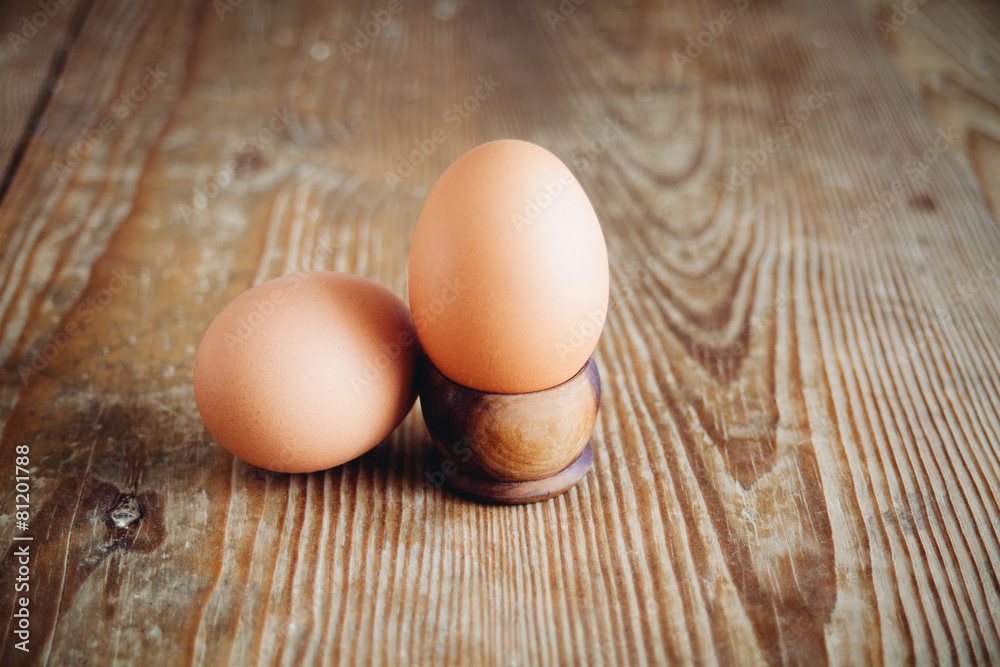 eggs on wooden surface eggs on wooden surface