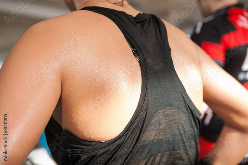 detail gym shot - sweat skin of a woman's back; spinnig, aerobic