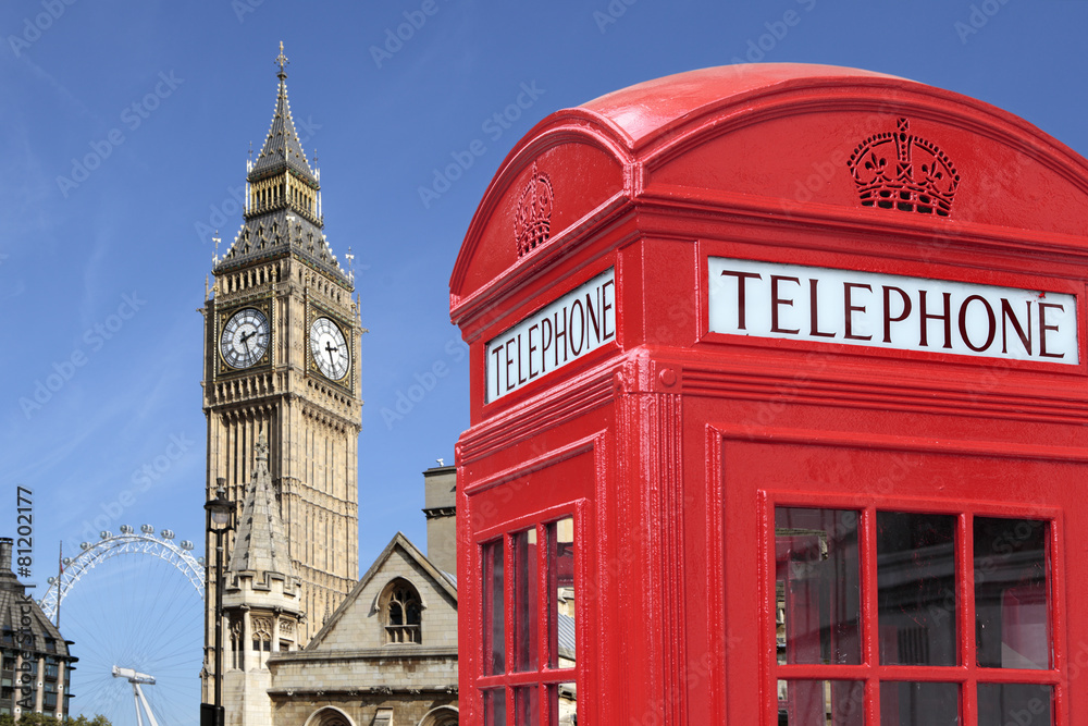 London red telephone box booth with westminster houses of parliament building and Big Ben clock tower in the background photo - obrazy, fototapety, plakaty 
