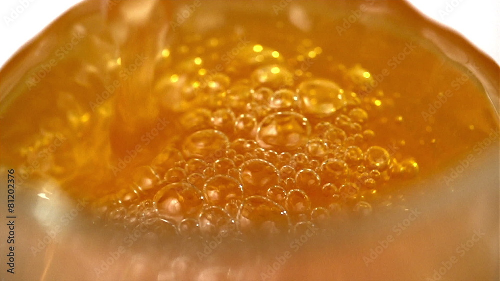 Orange Soda Pouring with bubbles into Glass. Orange Soda Pouring with bubbles into Glass.