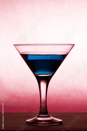 Martini glass on wooden table