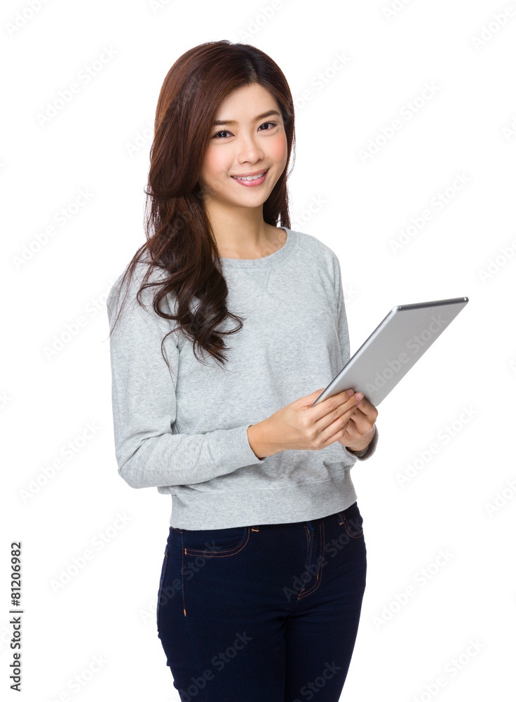 Smiling asian young woman watching the tablet pc Smiling asian young woman watching the tablet pc