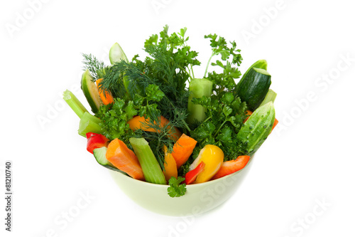 The plate of cuttted vegetables in green bowl