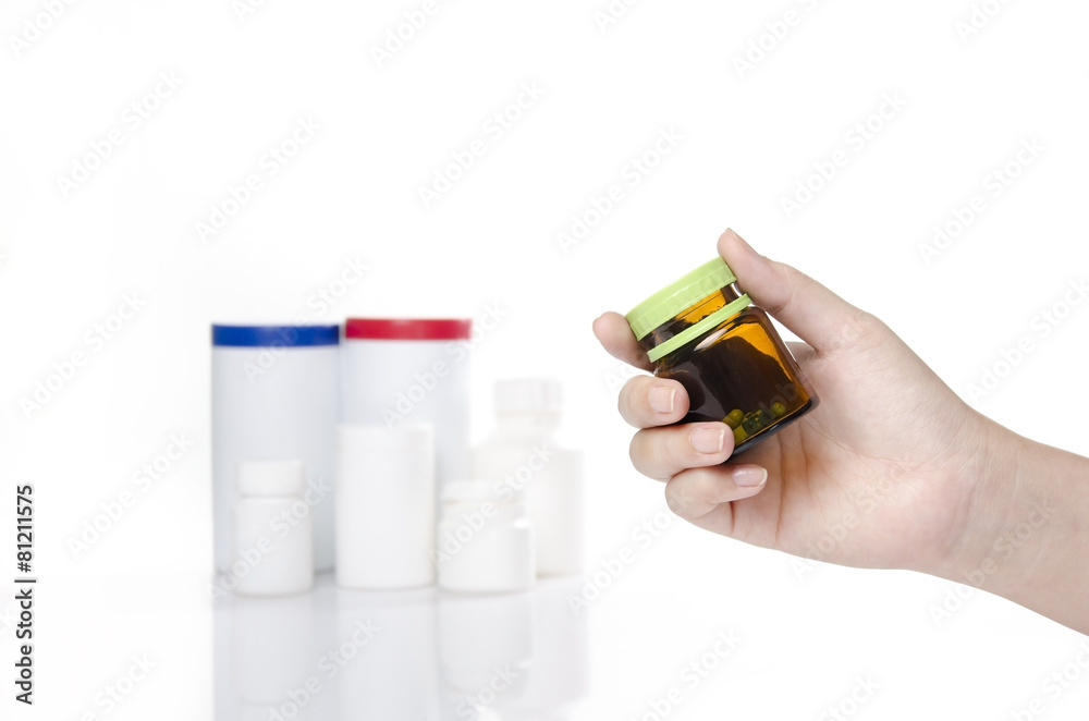 woman hand holding a bottle of medicine woman hand holding a bottle of medicine
