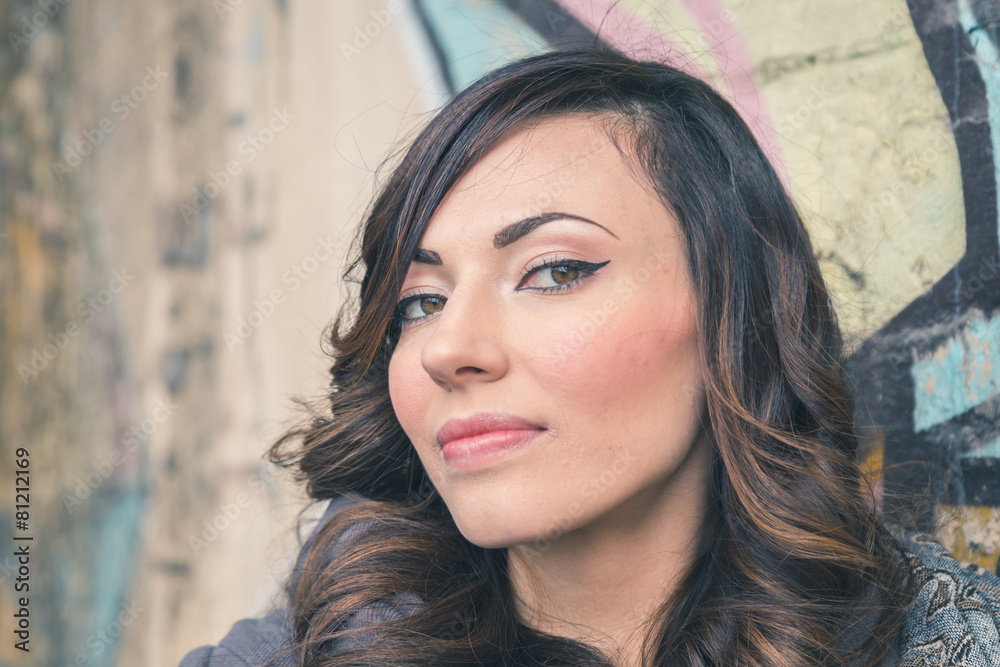 Beautiful girl posing in an urban context Beautiful girl posing in an urban context