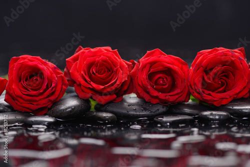 Still life with red rose and therapy stones