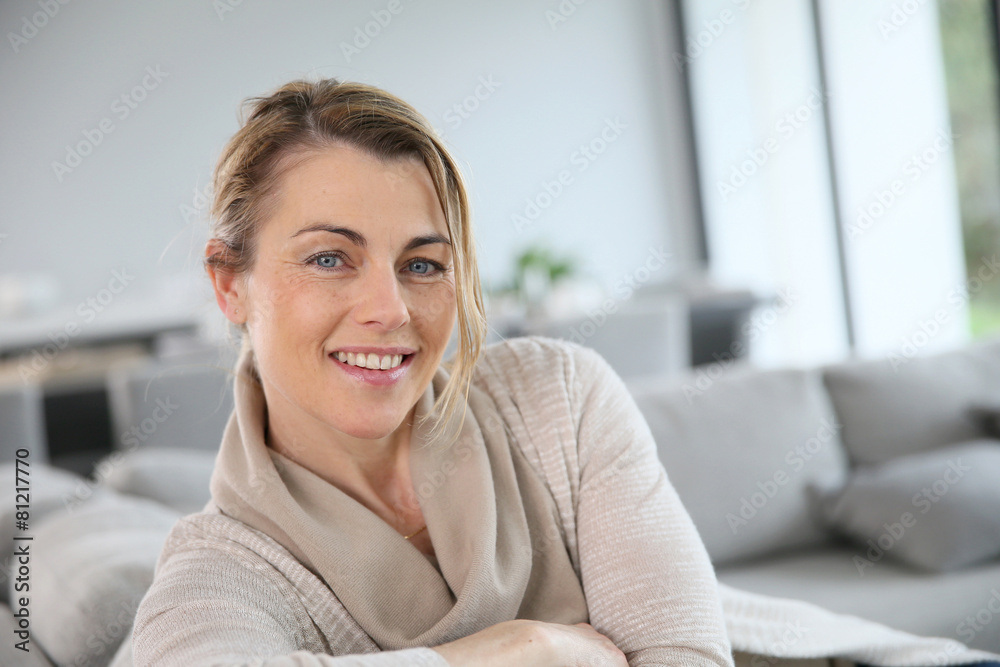 Portrait of mature woman relaxing in sofa Portrait of mature woman relaxing in sofa