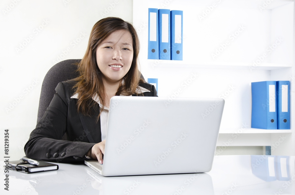 Female business person working in the office Female business person working in the office