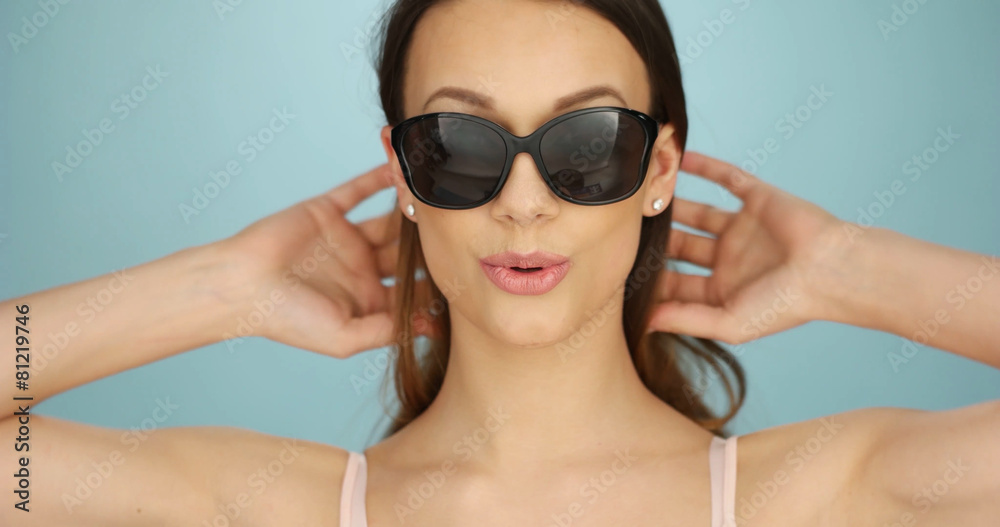 Cute vivacious woman in sunglasses Cute vivacious woman in sunglasses