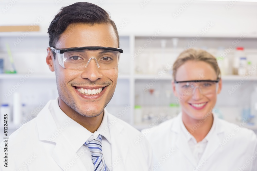 Fototapeta premium Scientists smiling and looking at camera
