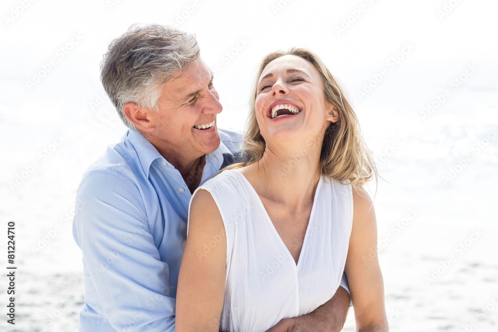 Happy couple laughing together Happy couple laughing together