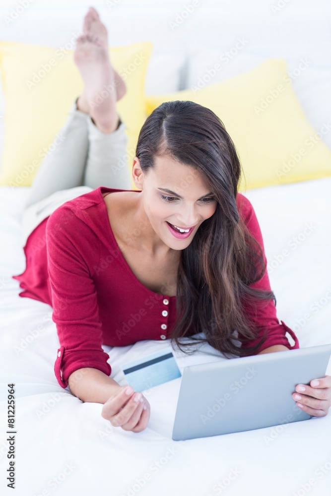 Pretty brunette doing shopping online Pretty brunette doing shopping online