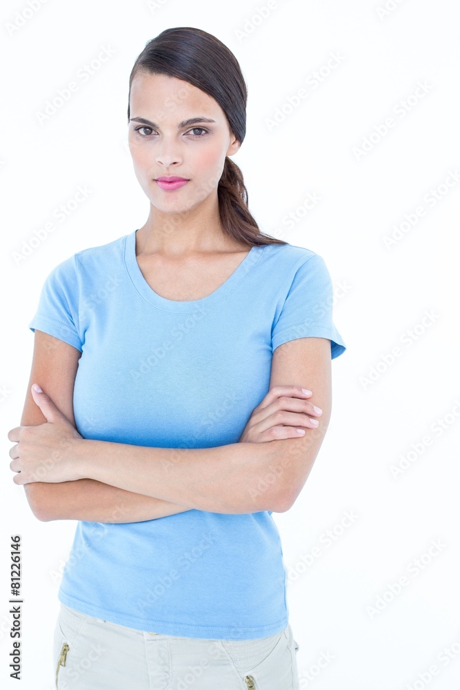 Unsmiling woman looking at camera with arms crossed Unsmiling woman looking at camera with arms crossed
