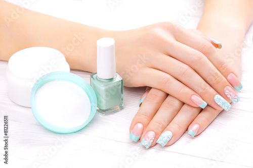 turquoise french manicure with light towel
