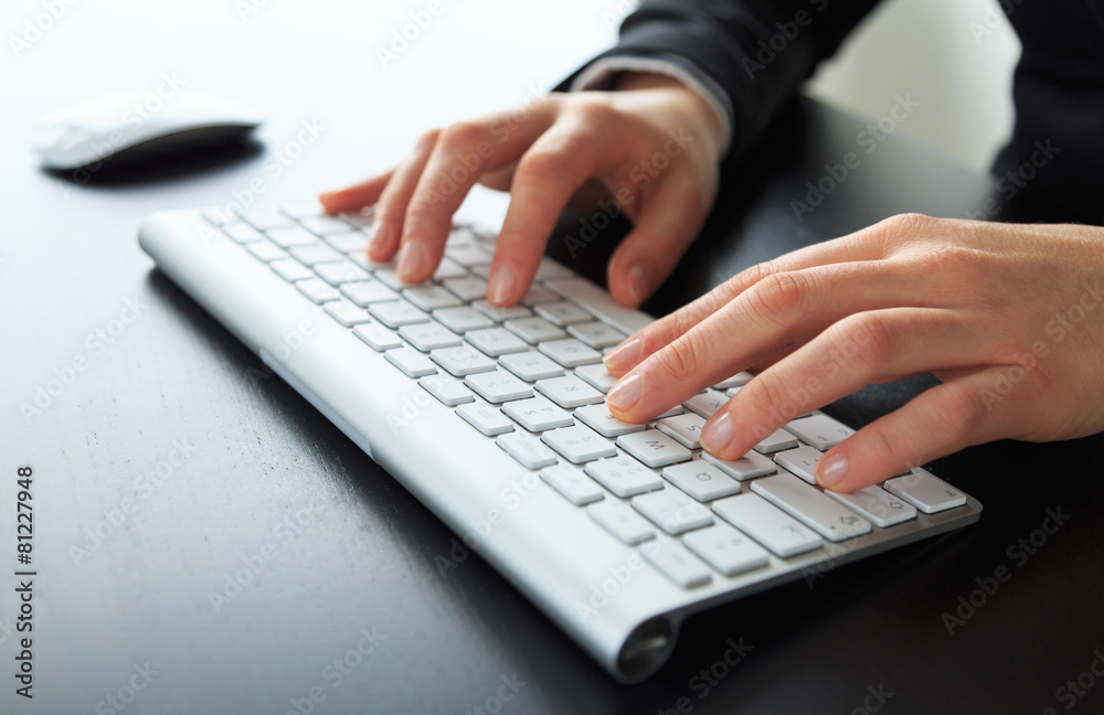 Close-up of female hands at a keyboard/computer. Shallow DOF. Close-up of female hands at a keyboard/computer. Shallow DOF.