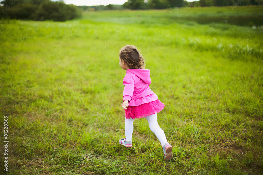 beautiful carefree girl playing outdoors in field beautiful carefree girl playing outdoors in field