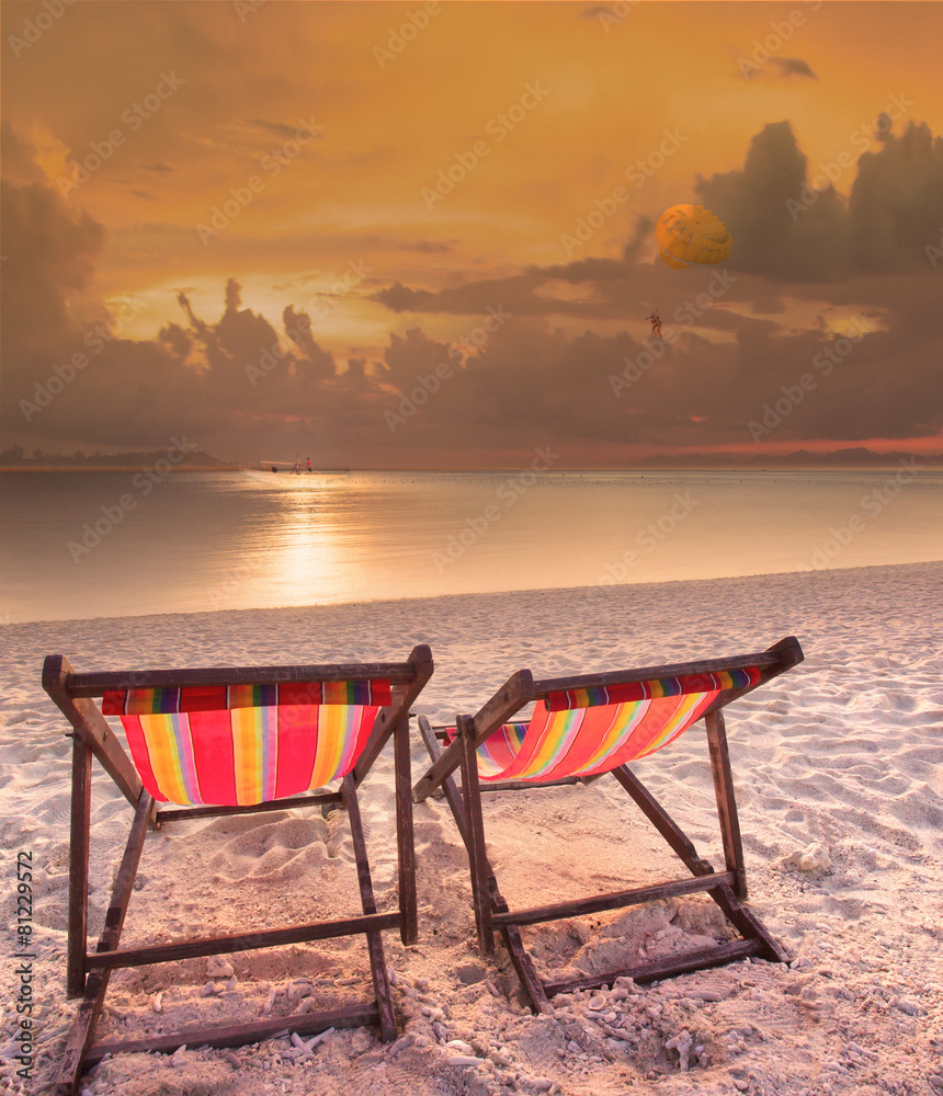 couples of wood chairs beach at sea side and parashoot ship play