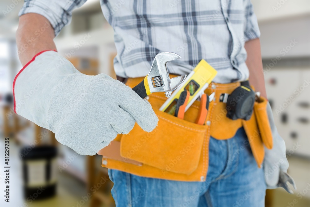 technician using adjustable wrench against white background technician using adjustable wrench against white background