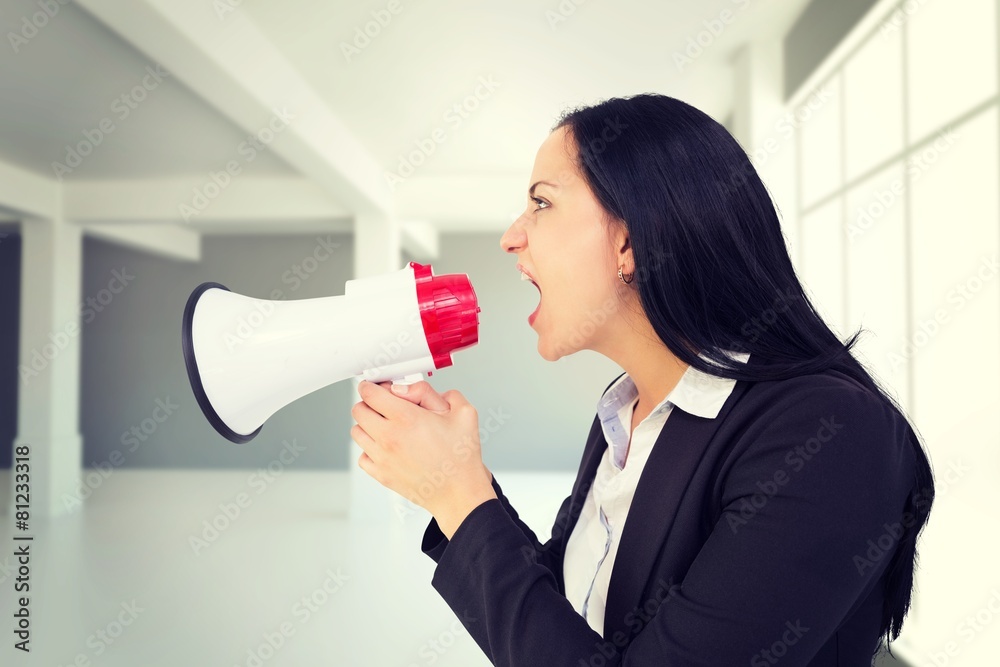 Composite image of pretty businesswoman shouting with megaphone Composite image of pretty businesswoman shouting with megaphone