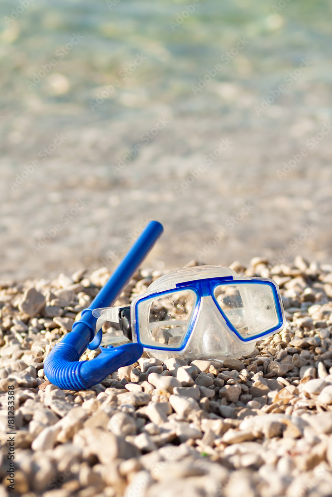 diving mask glasses and pipe at summer beach