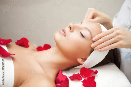 Spa salon  Young Beautiful Woman Having Facial Massage