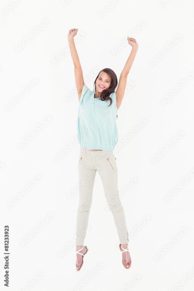 Pretty woman jumping looking at camera Pretty woman jumping looking at camera