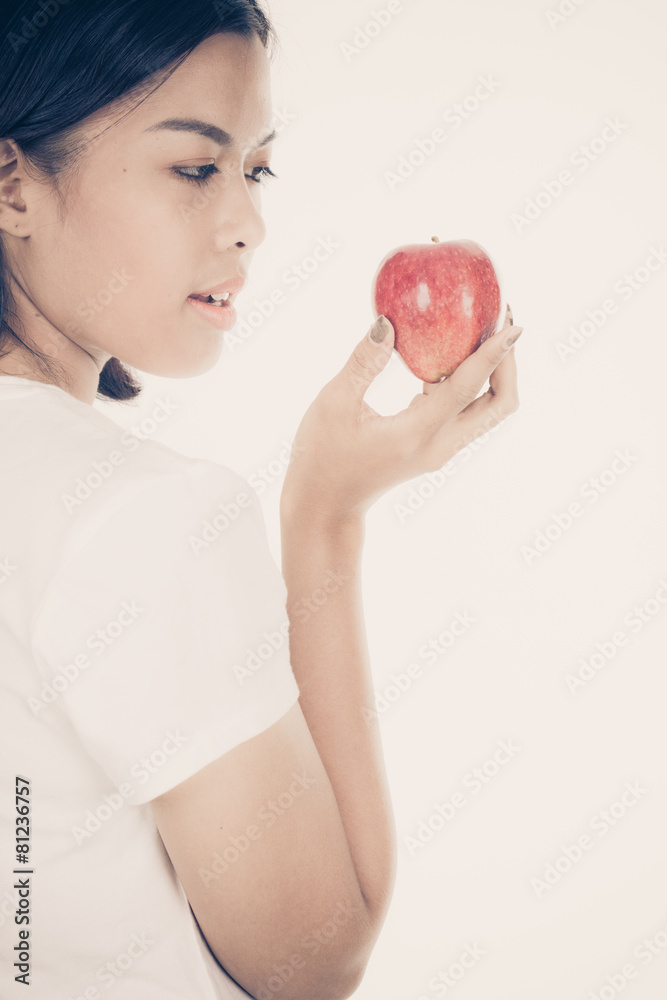 Smiling woman with apple isolated on white Smiling woman with apple isolated on white
