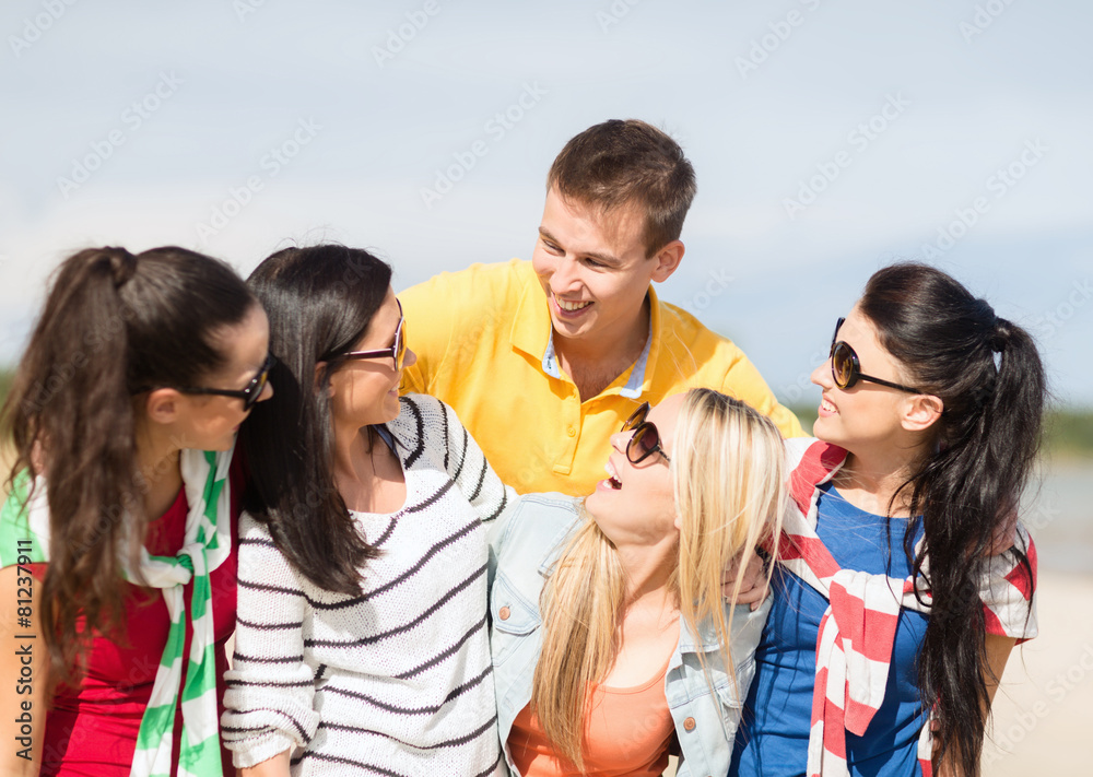 group of happy friends having fun on beach group of happy friends having fun on beach