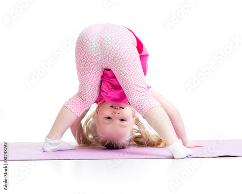 little girl standing on her...