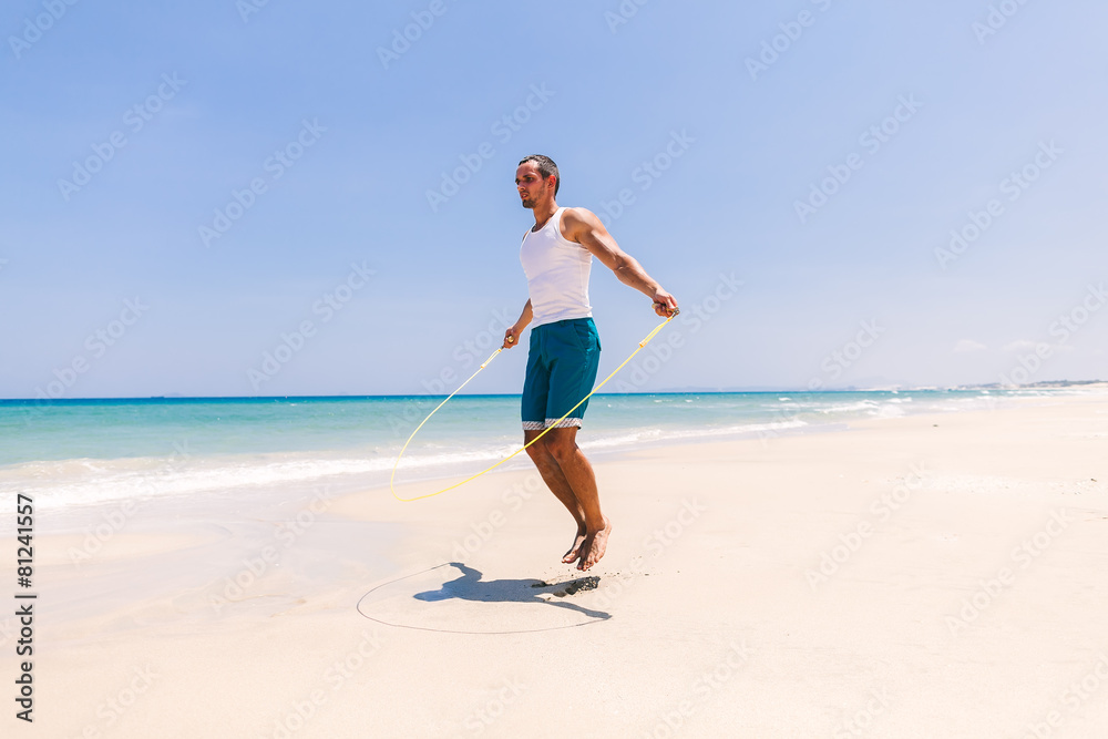 handsome man skipping on the beach handsome man skipping on the beach