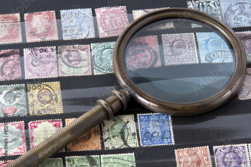 Stamps album with magnifying glass