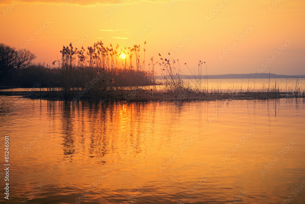 Beautiful Sunset Over the Lake in Early Spring Beautiful Sunset Over the Lake in Early Spring