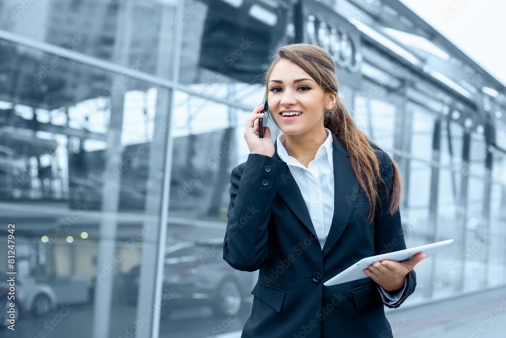 Successful businesswoman or entrepreneur using a digital tablet