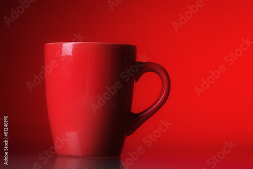 Red cup over red background