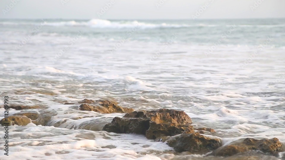 Ocean view in Hikkaduwa in sunset with waves splashing the beach. Ocean view in Hikkaduwa in sunset with waves splashing the beach.