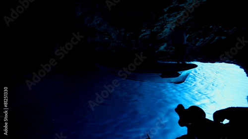 BISEVO, CROATIA - AUGUST 20: Tourists on boat in the Blue Hole cave on August 20, 2012 in Bisevo, Croatia. The cave is only blue for 1 hour around noon, so tourists rush to see the magical colour.
