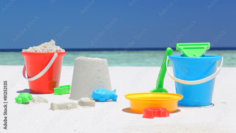 woman on beach blurred sitting down behind tools woman on beach blurred sitting down behind tools
