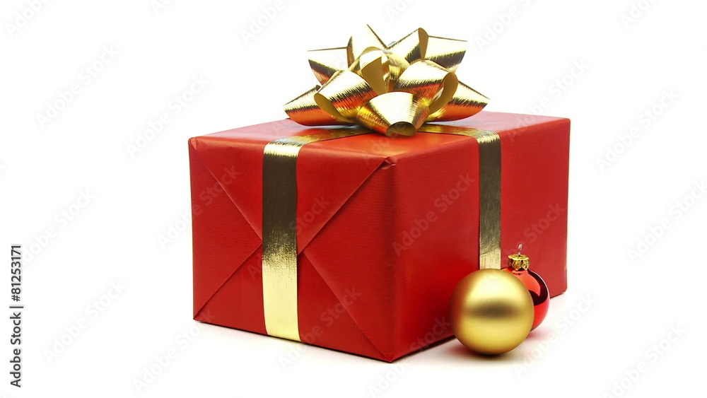 red christmas present with baubles and ribbon looping