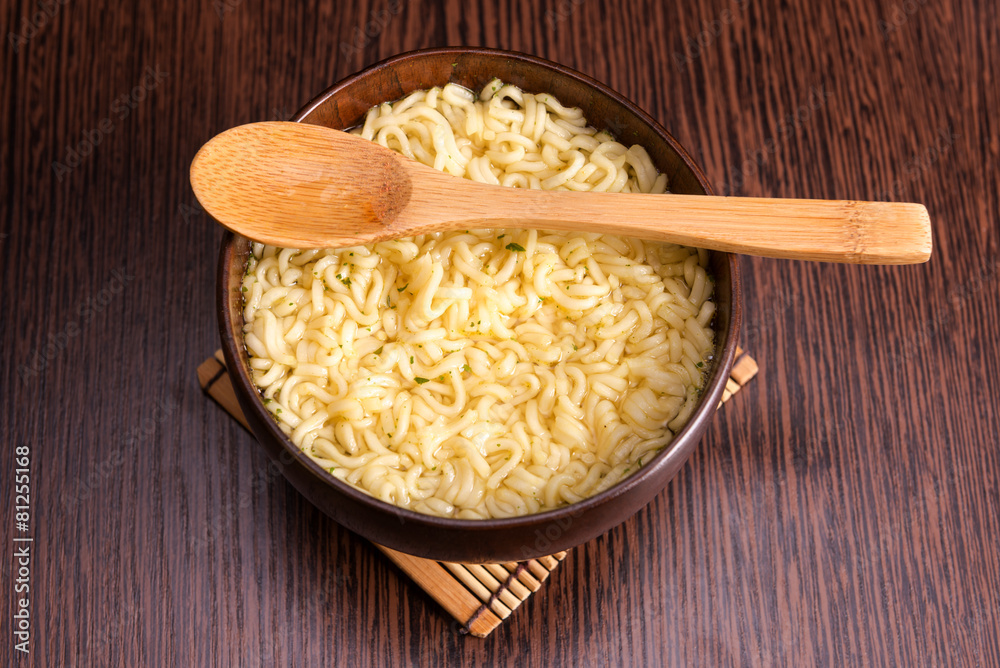 Instant noodles in a wooden bowl Instant noodles in a wooden bowl