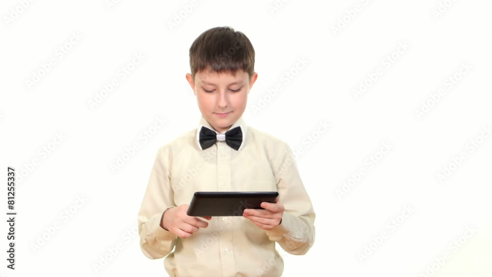 School boy looking for something using tablet computer, on white School boy looking for something using tablet computer, on white