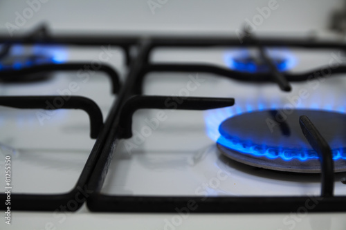 Blue flames of gas burning from a kitchen gas stove
