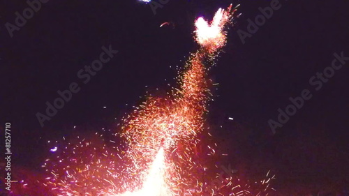 People starting fireworks on beach. 